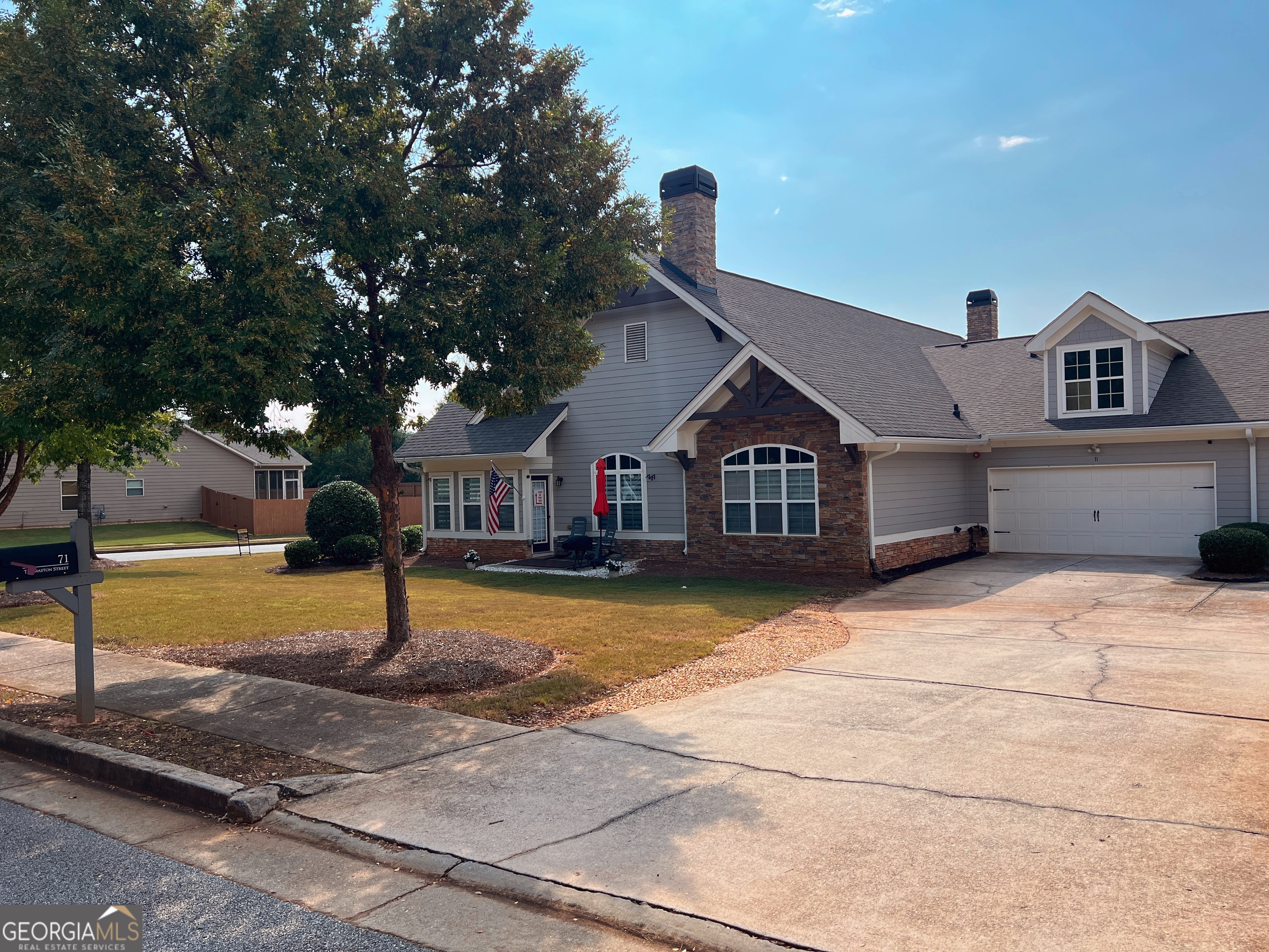71 Thomaston Street Newnan, GA 30263 - Photo 36 of 38 a front view of a house with a yard