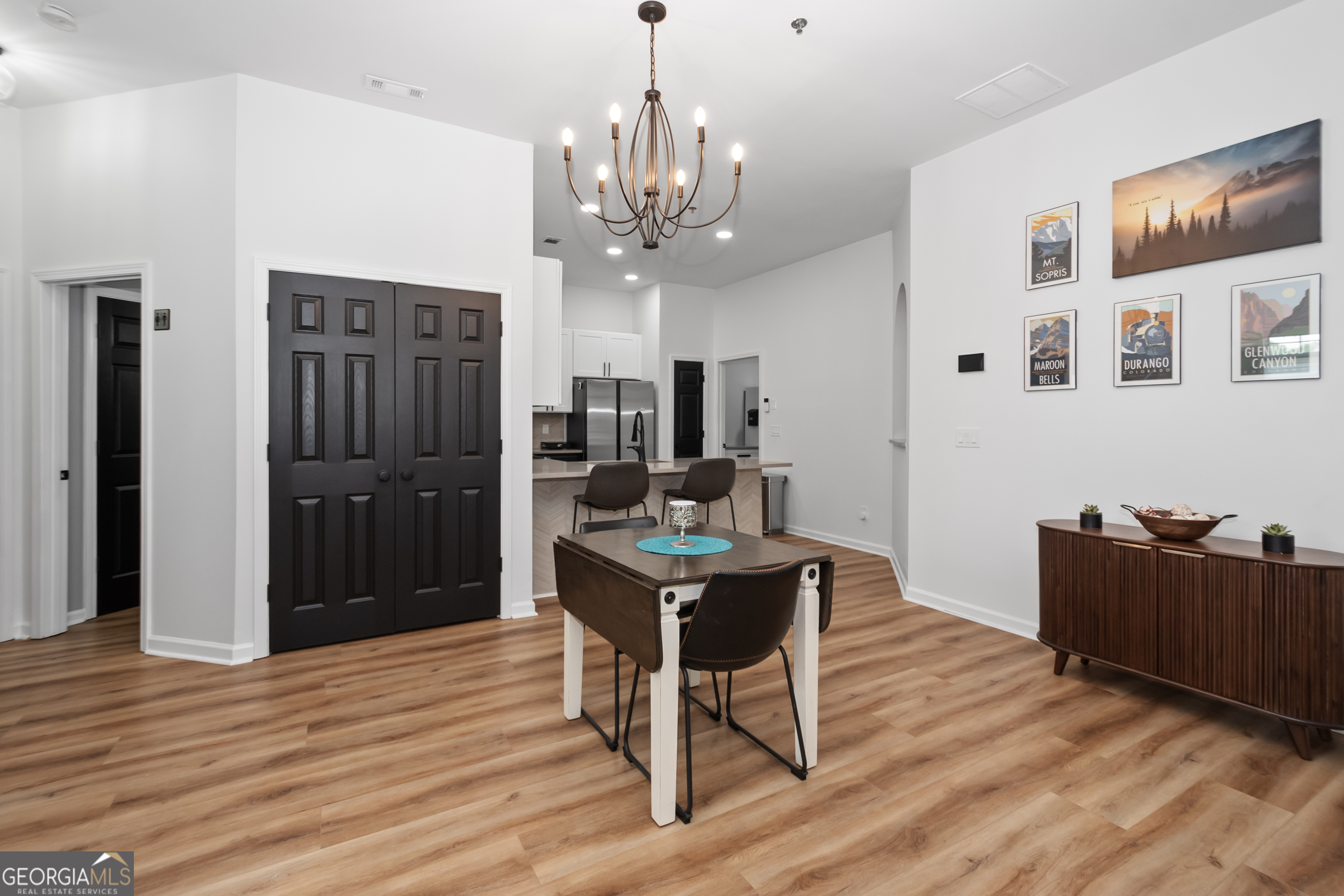 71 Thomaston Street Newnan, GA 30263 - Photo 9 of 38 a view of a livingroom with furniture and wooden floor