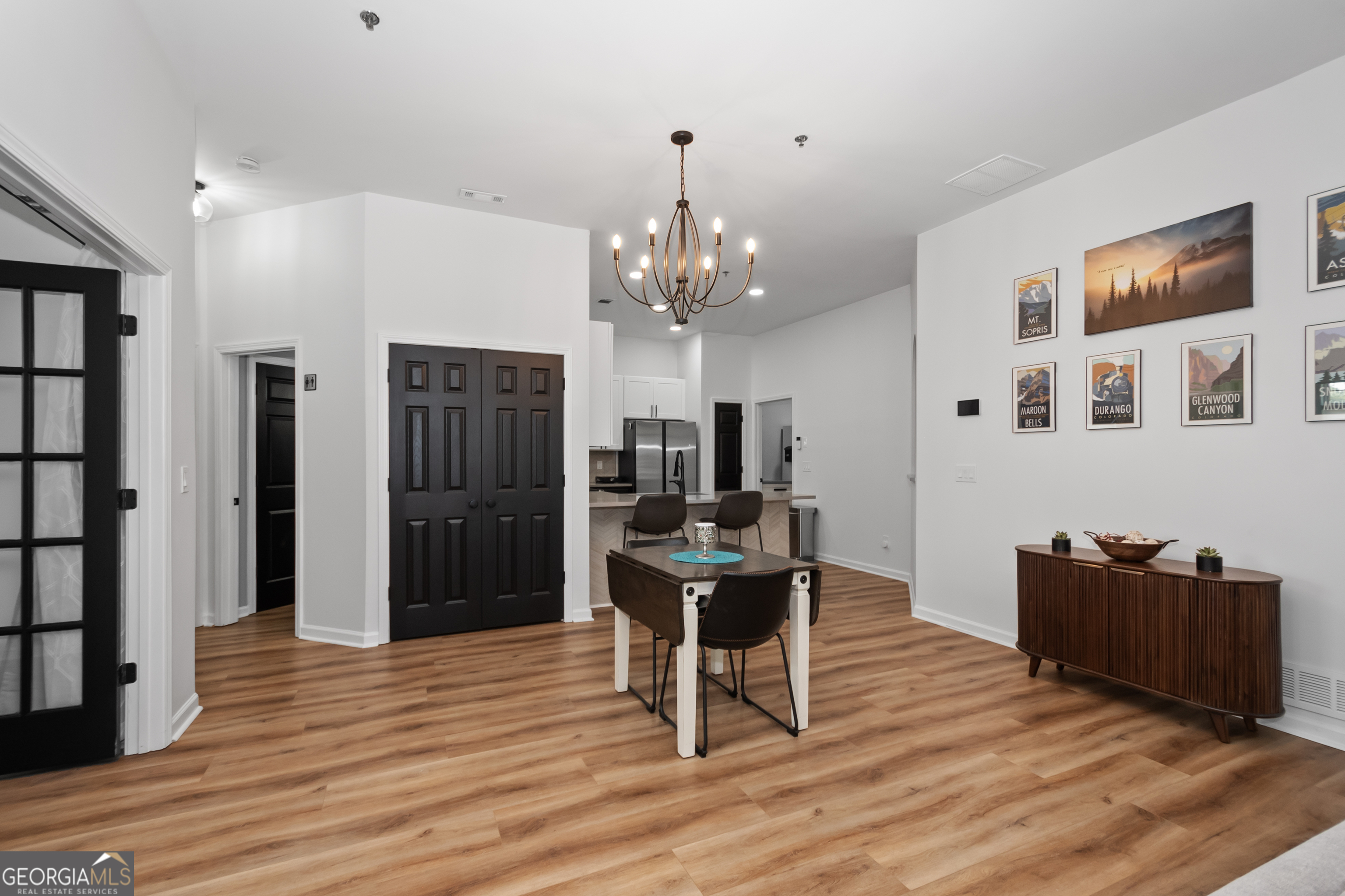 71 Thomaston Street Newnan, GA 30263 - Photo 10 of 38 a view of a dining room with furniture and chandelier