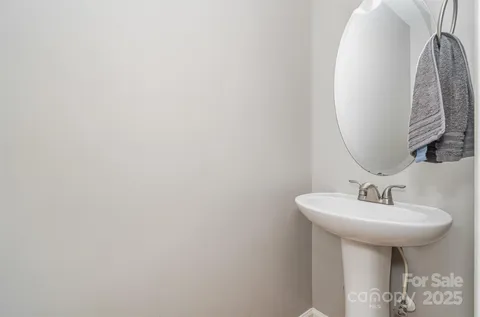a bathroom with a sink and mirror