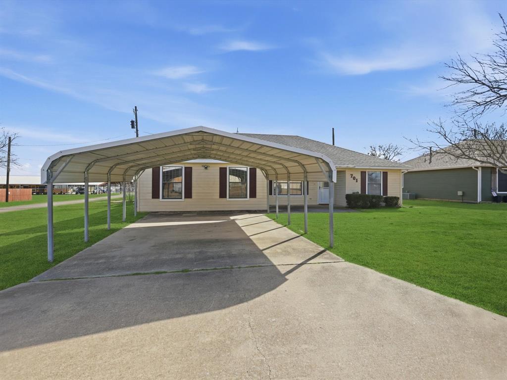 701 College Street Celeste, TX 75423 - Photo 3 of 29 a front view of house with yard and green space