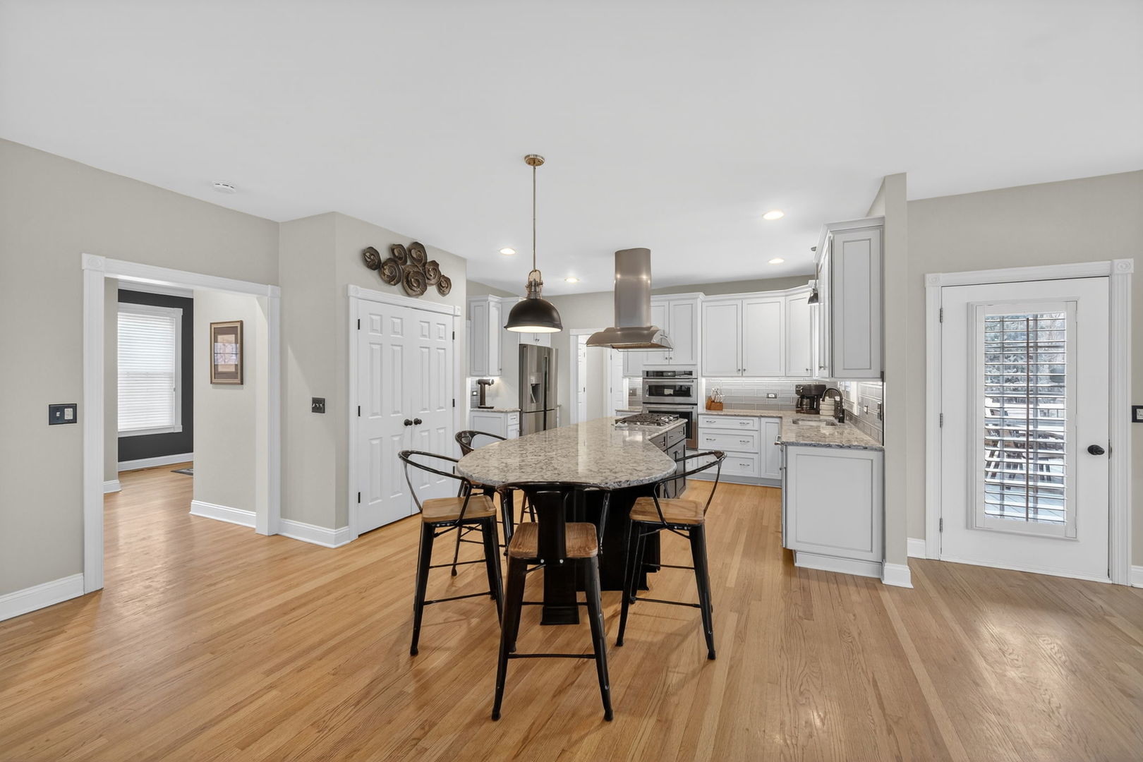 5304 Rita Avenue Crystal Lake, IL 60014 - Photo 13 of 59 a view of a dining room with furniture and wooden floor