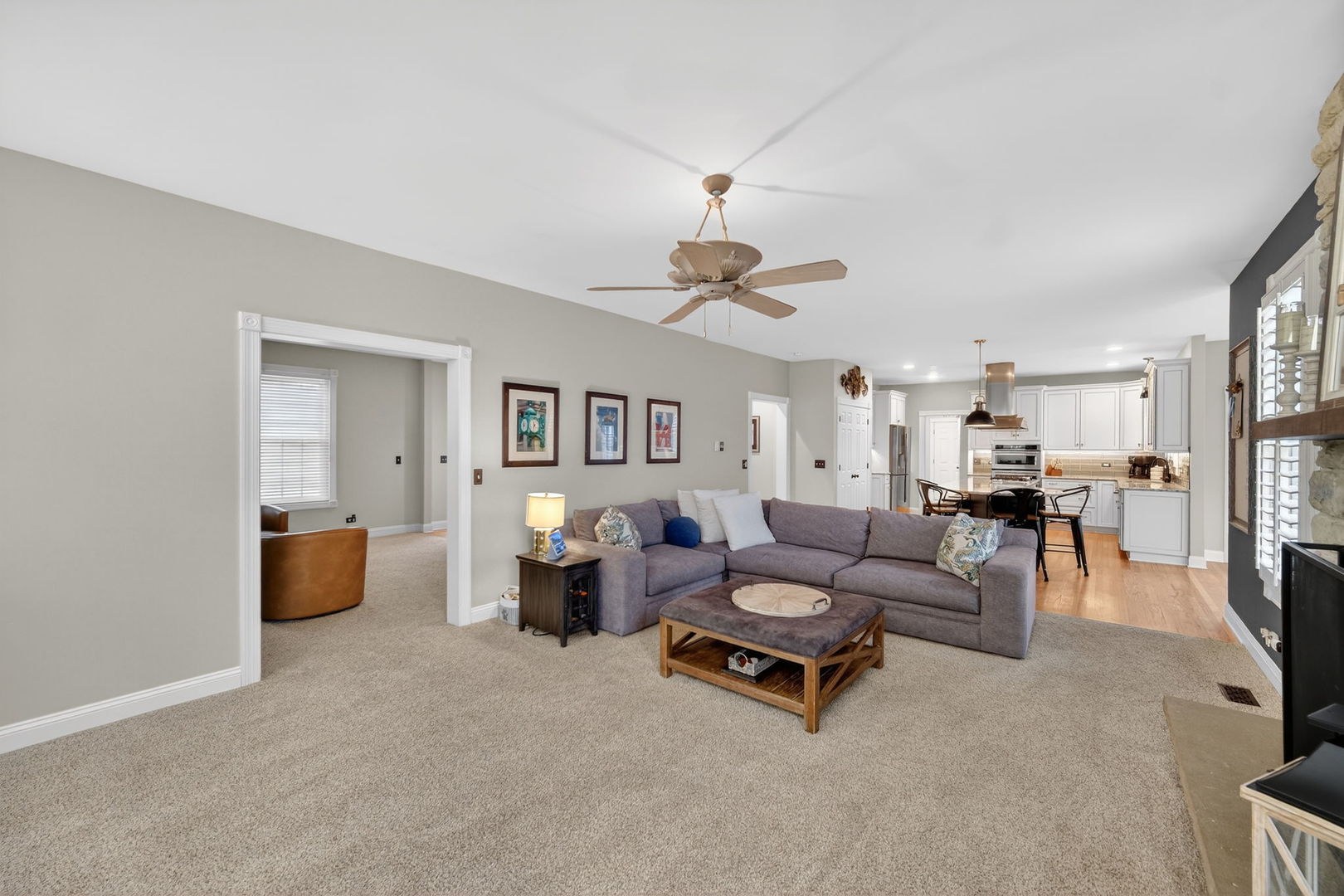5304 Rita Avenue Crystal Lake, IL 60014 - Photo 21 of 59 a living room with furniture and a chandelier