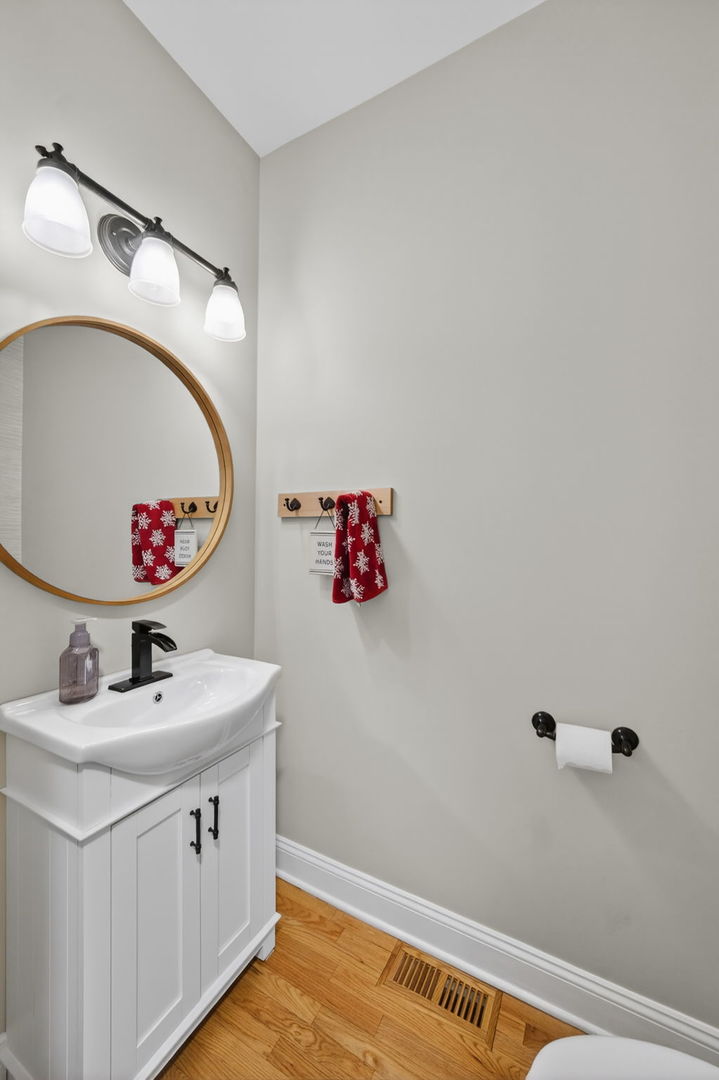 5304 Rita Avenue Crystal Lake, IL 60014 - Photo 25 of 59 a bathroom with a sink and a mirror