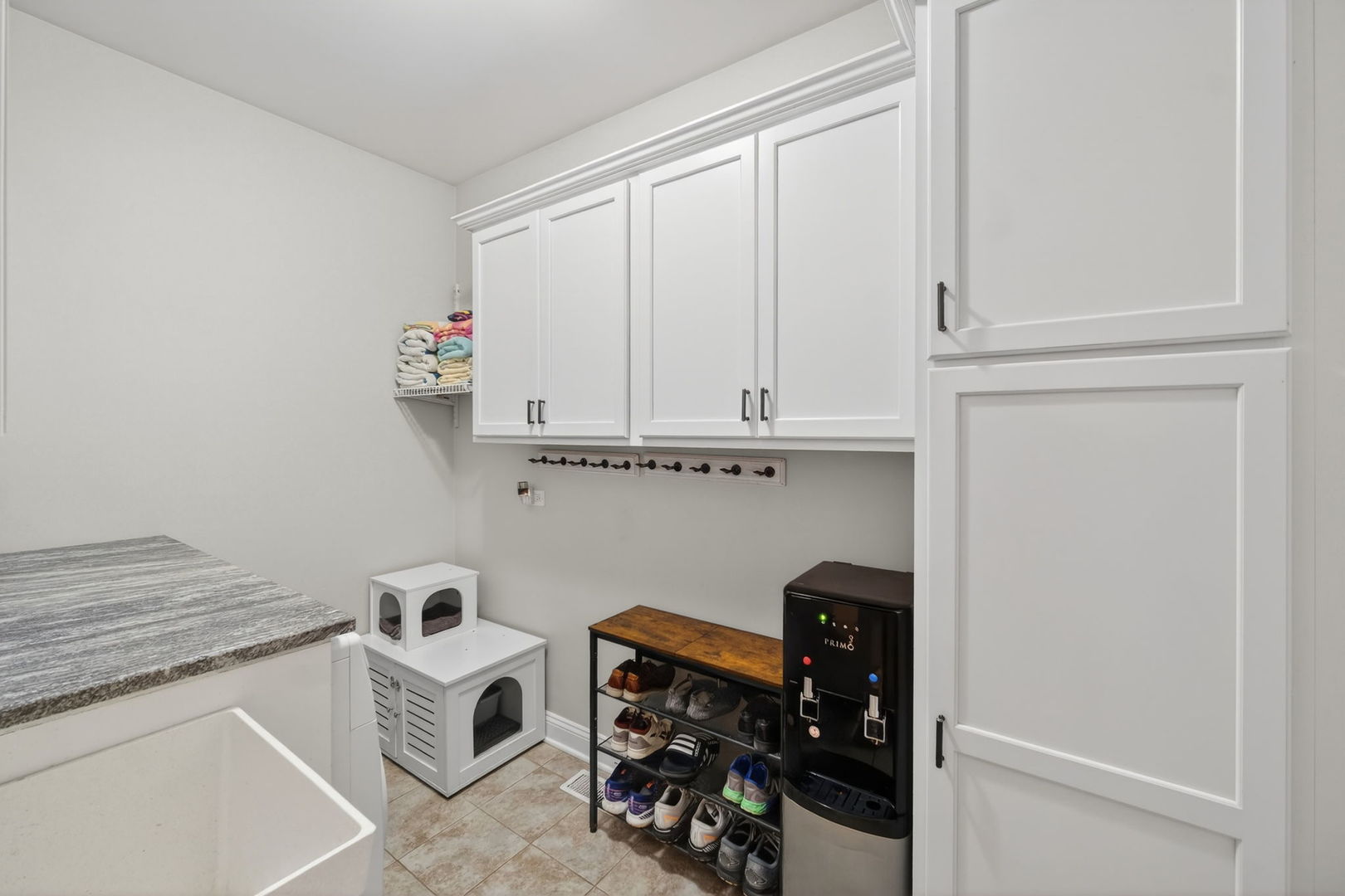 5304 Rita Avenue Crystal Lake, IL 60014 - Photo 27 of 59 a kitchen with white cabinets and white appliances