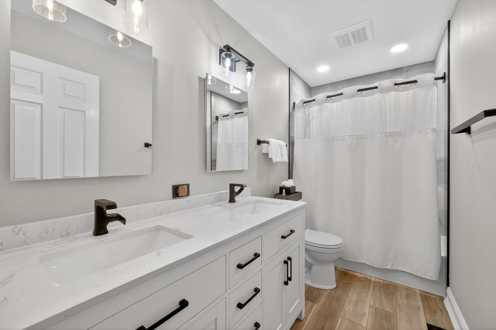 5304 Rita Avenue Crystal Lake, IL 60014 - Photo 39 of 59 a bathroom with a sink a toilet and a mirror