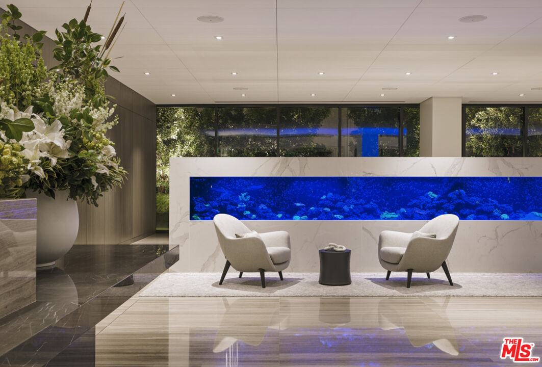 11750 Wilshire Boulevard, Unit 2404 Los Angeles, CA 90025 - Photo 26 of 38 a living room with furniture and a potted plant