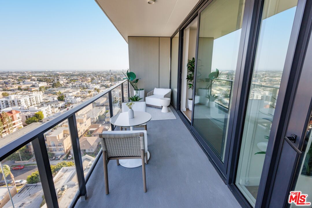 11750 Wilshire Boulevard, Unit 2404 Los Angeles, CA 90025 - Photo 10 of 38 a view of a balcony with chairs