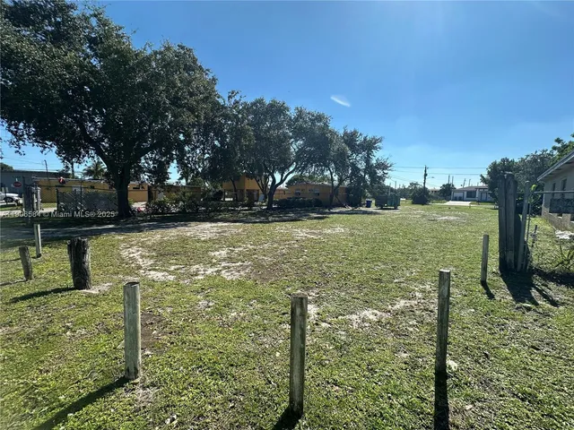 a backyard of a house with yard barbeque oven and outdoor seating