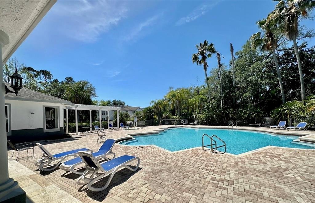 4348 South Kirkman Road, Unit 806 Orlando, FL 32811 - Photo 20 of 29 a view of a swimming pool with lounge chairs