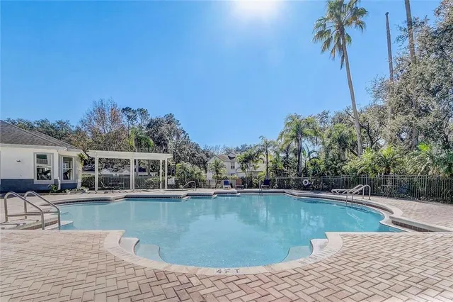 a view of a swimming pool with a patio