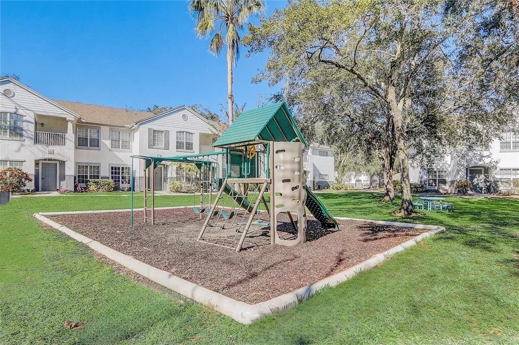 4348 South Kirkman Road, Unit 806 Orlando, FL 32811 - Photo 24 of 29 a view of a house with a yard