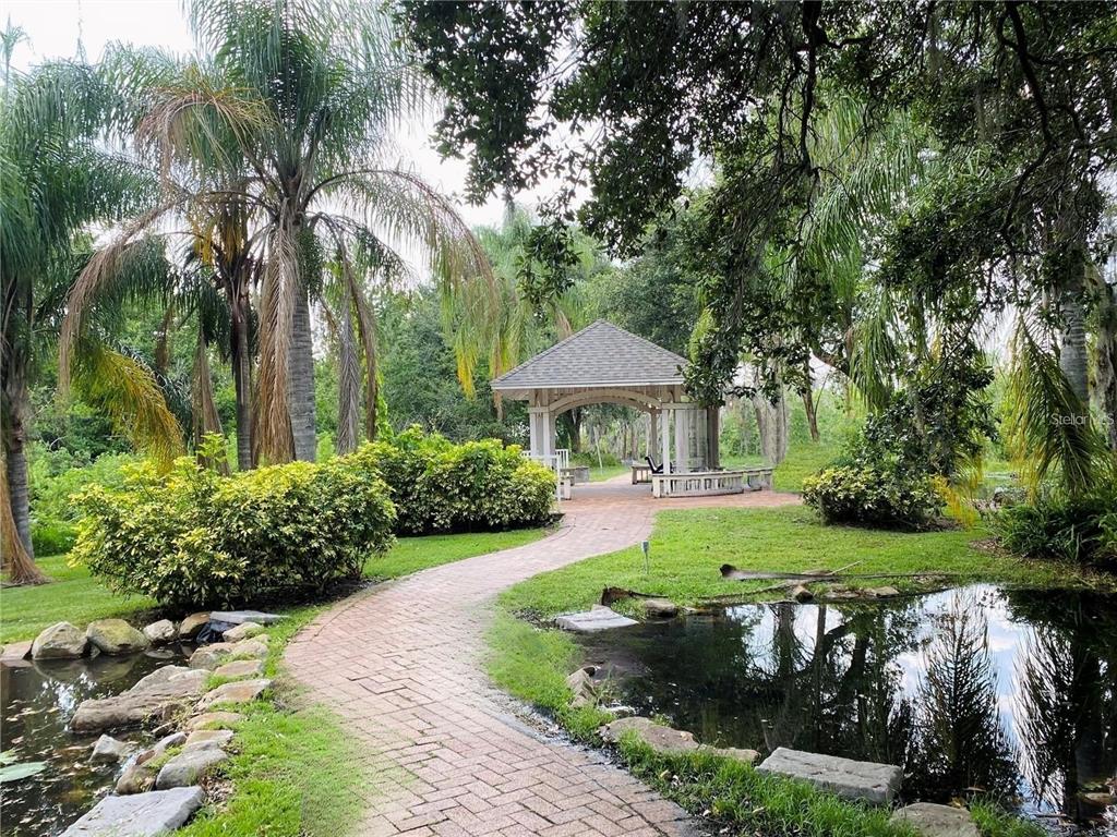 4348 South Kirkman Road, Unit 806 Orlando, FL 32811 - Photo 26 of 29 a front view of a house with garden