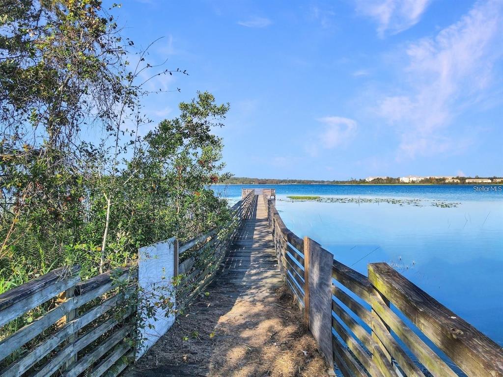 4348 South Kirkman Road, Unit 806 Orlando, FL 32811 - Photo 27 of 29 a view of a balcony with wooden floor and city view