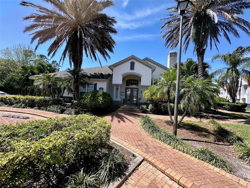4348 South Kirkman Road, Unit 806 Orlando, FL 32811 - Photo 3 of 29 a front view of house with yard and green space