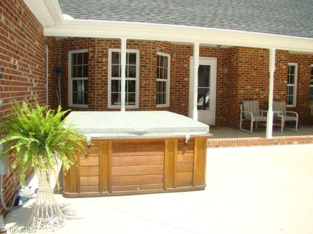 3723 Earnhardt Road Asheboro, NC 27205 - Photo 13 of 16 Patio/Deck. Covered back porch and hot tub