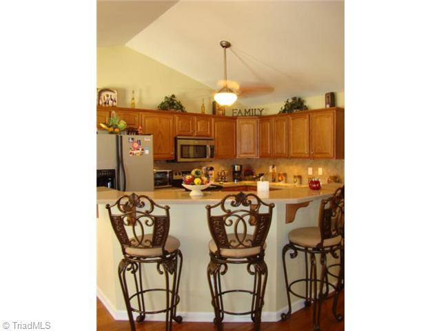 3723 Earnhardt Road Asheboro, NC 27205 - Photo 5 of 16 Kitchen. Vaulted ceiling & hardwood floors
