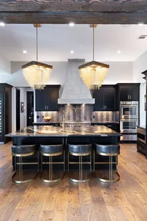 a kitchen with a table and chairs in it