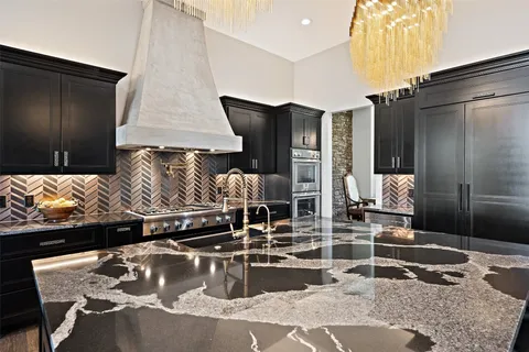 a kitchen with a table and chairs