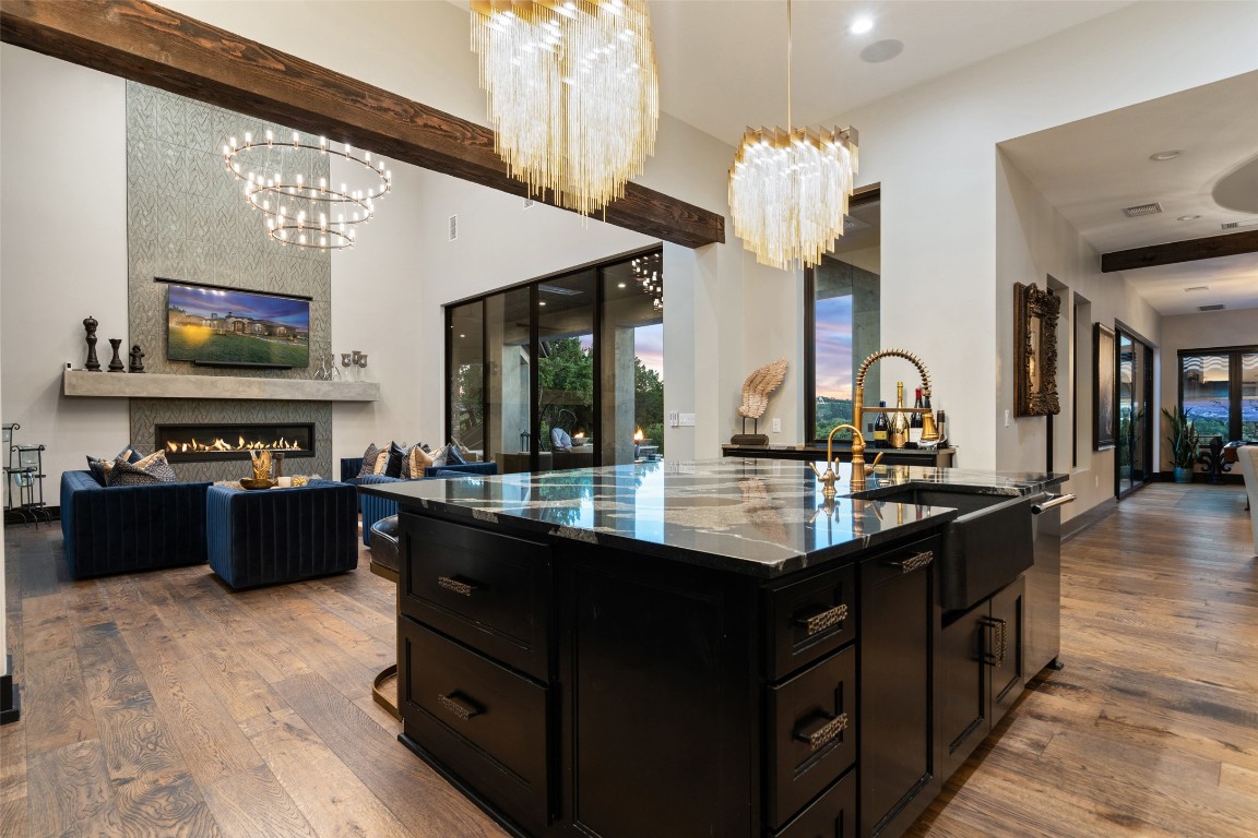 19204 Secretariat Place Spicewood, TX 78669 - Photo 15 of 40 a kitchen with granite countertop a sink and a stove