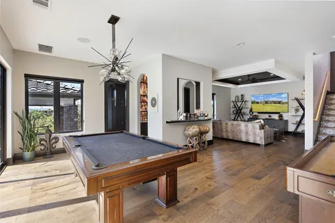 a dining room with a table and chairs