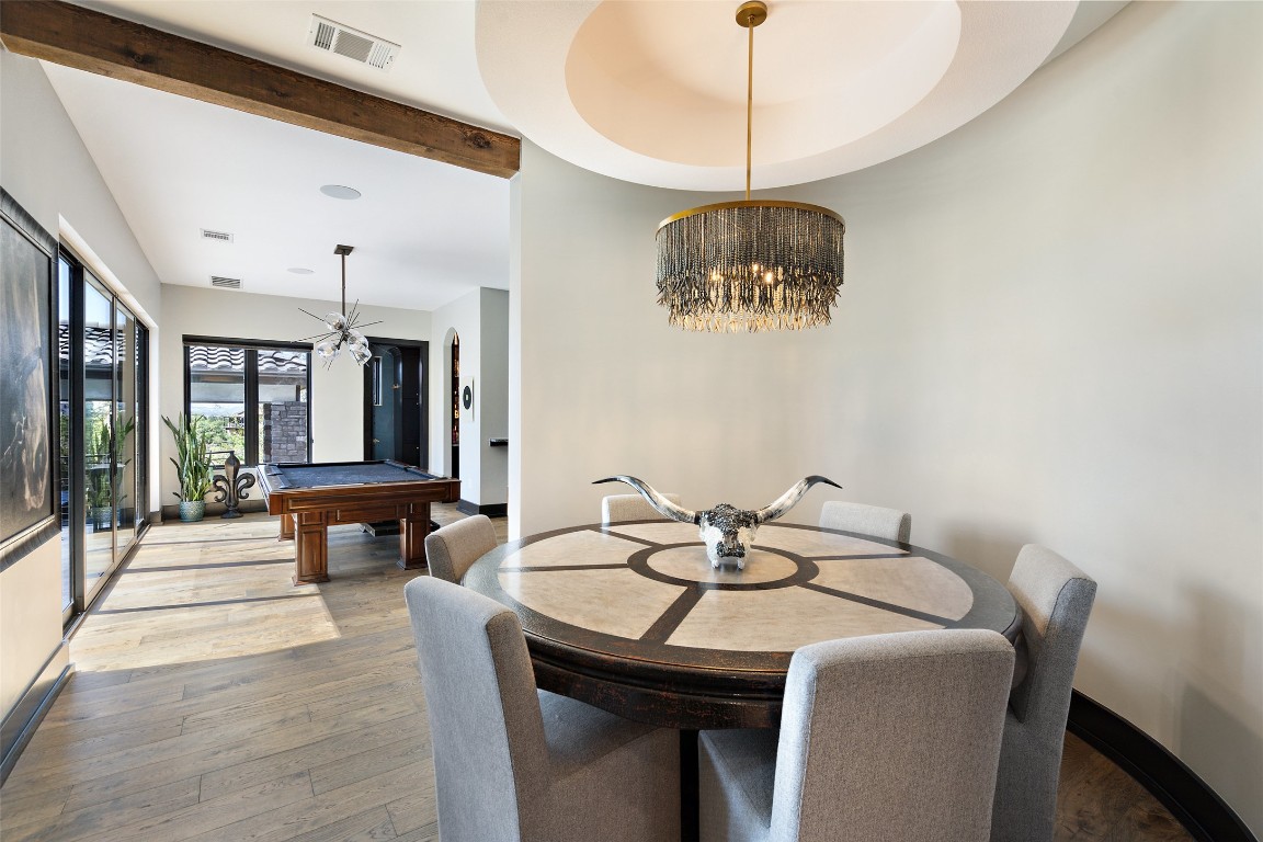 19204 Secretariat Place Spicewood, TX 78669 - Photo 23 of 40 a dining room with a table and chairs