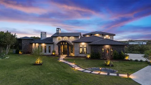 a view of a house with swimming pool and a yard