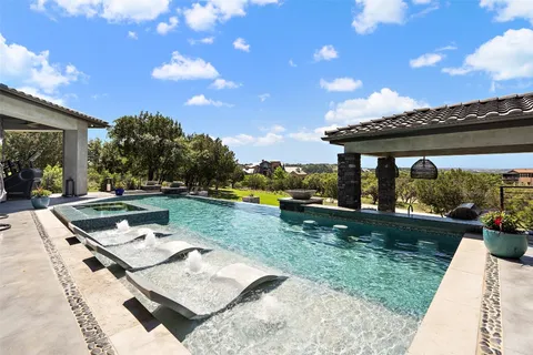 a view of a backyard with sitting area