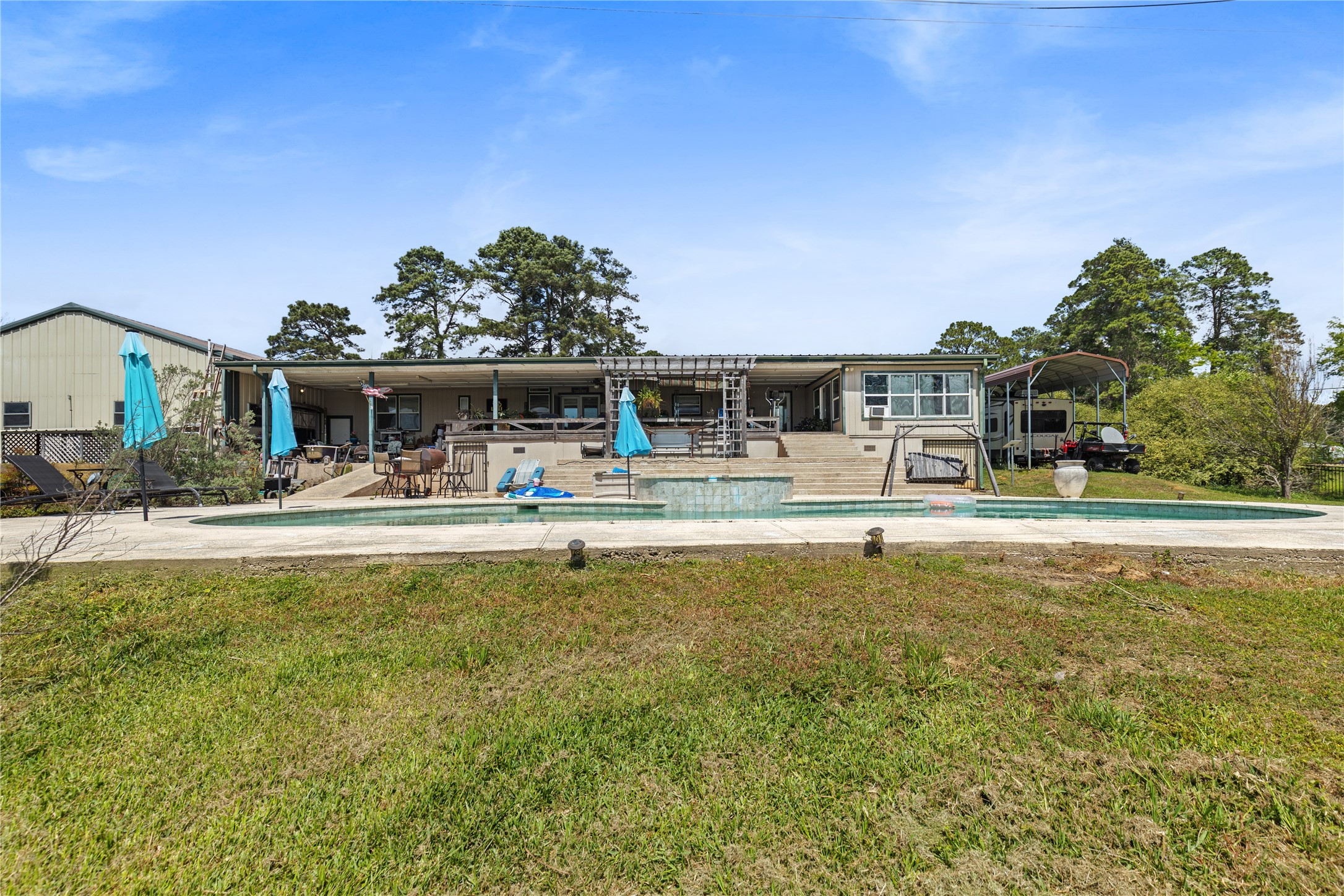 174 Lake Front Drive Trinity, TX 75862 - Photo 34 of 44 a view of a swimming pool with outdoor seating
