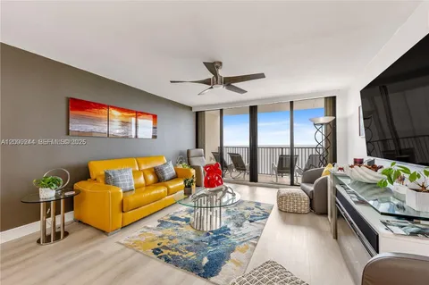 a living room with furniture fireplace and a flat screen tv