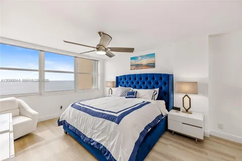 a bedroom with a bed and a couch