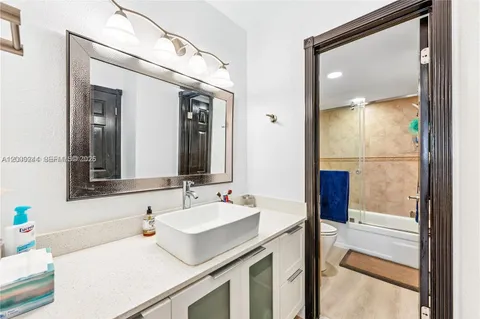 a bathroom with a sink and a mirror