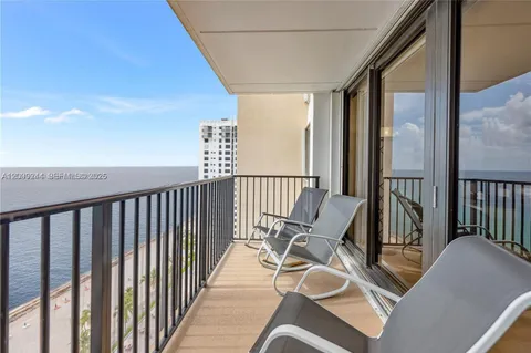 a view of balcony with furniture
