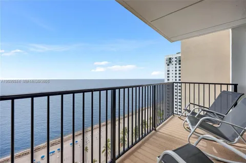 a view of balcony with wooden floor