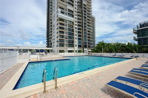 a view of a swimming pool with a yard