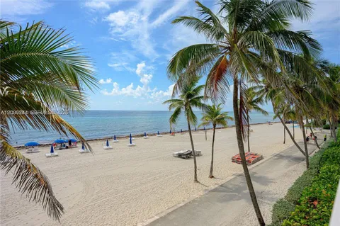 a view of outdoor space with palm trees