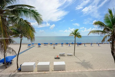 an ocean view with palm trees