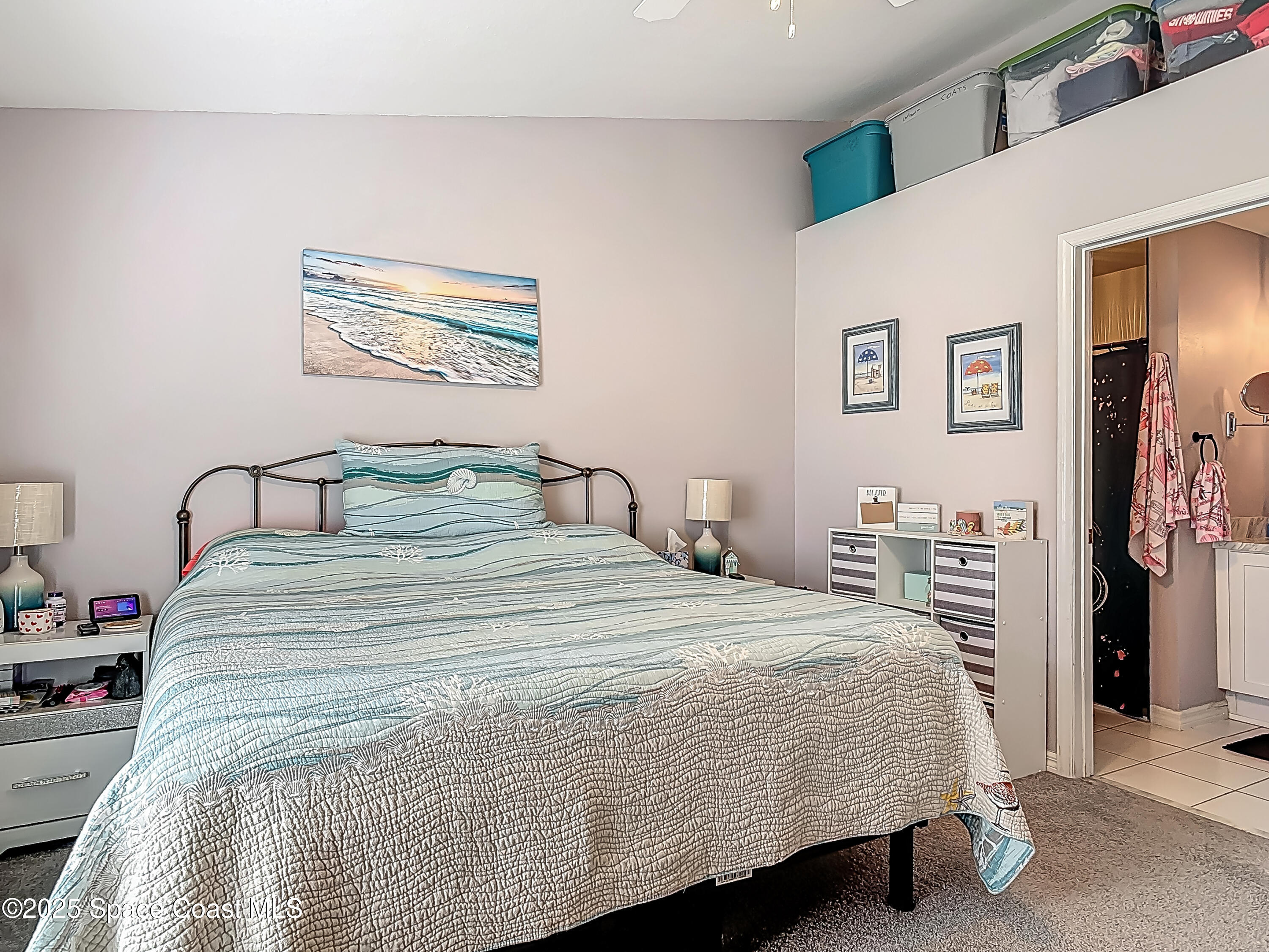 3104 Lime Tree Drive Edgewater, FL 32141 - Photo 15 of 32 a bedroom with a bed and a desk