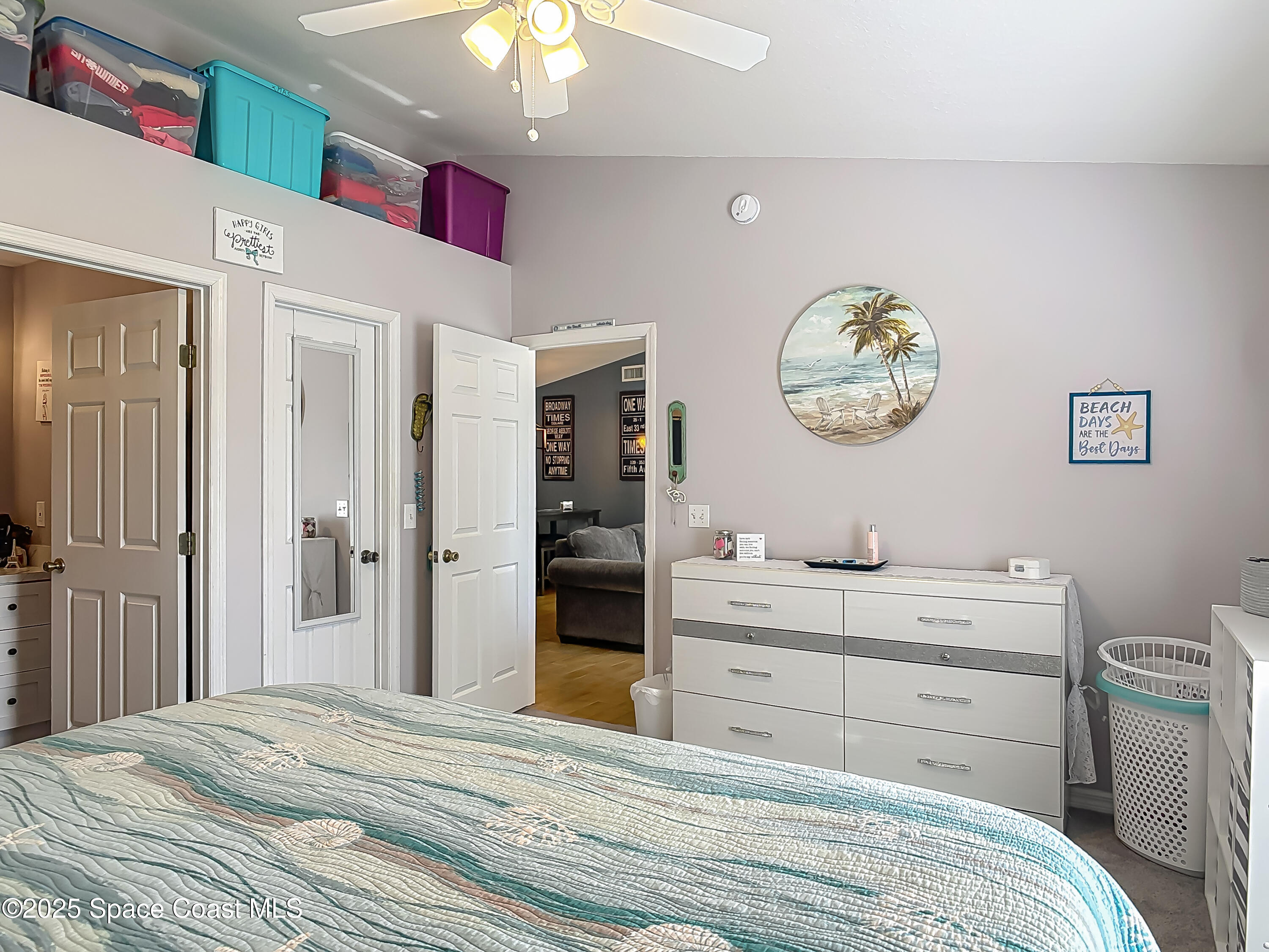 3104 Lime Tree Drive Edgewater, FL 32141 - Photo 16 of 32 a bedroom with a bed and a chandelier