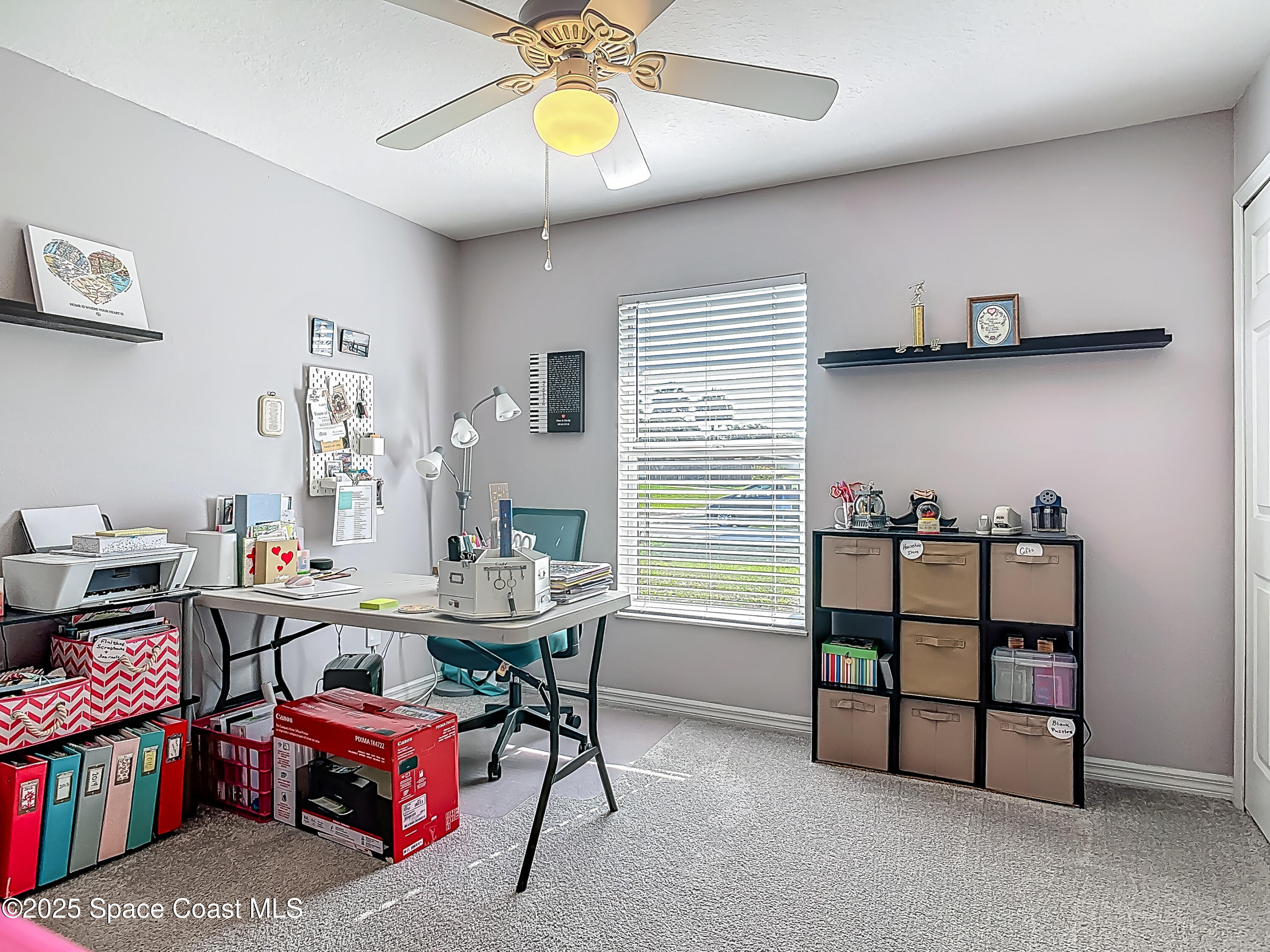 3104 Lime Tree Drive Edgewater, FL 32141 - Photo 18 of 32 a view of a workspace with furniture and a window