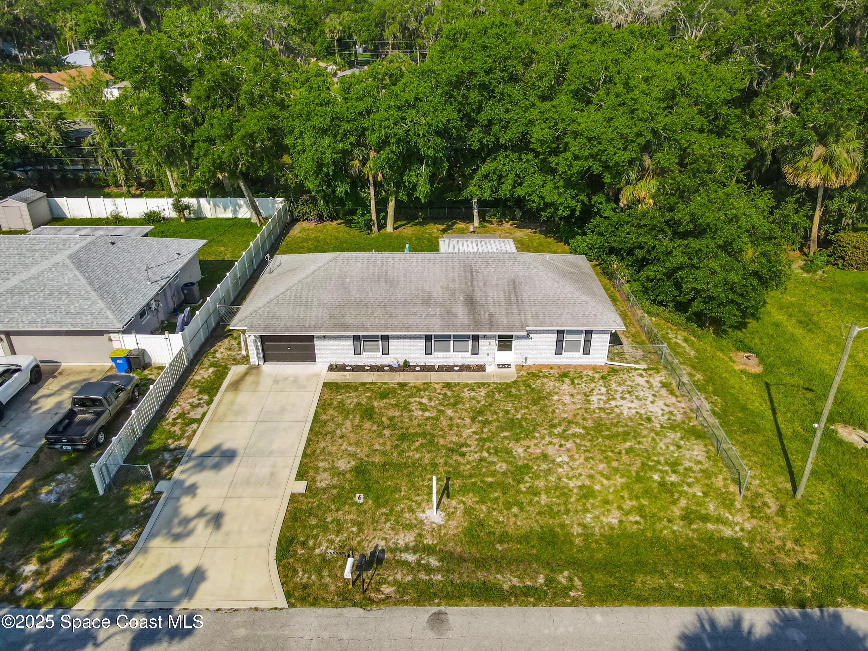 3104 Lime Tree Drive Edgewater, FL 32141 - Photo 2 of 32 an aerial view of a house with swimming pool