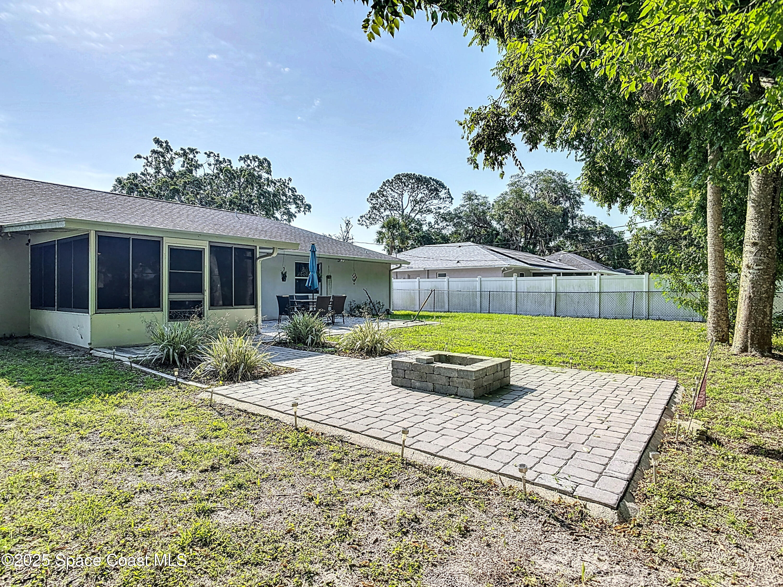 3104 Lime Tree Drive Edgewater, FL 32141 - Photo 24 of 32 a view of a house with backyard and a garden