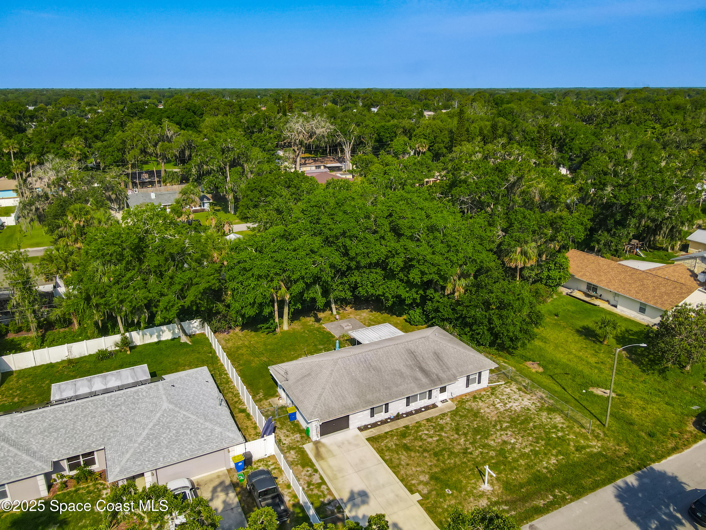 3104 Lime Tree Drive Edgewater, FL 32141 - Photo 31 of 32 an aerial view of a houses with a yard