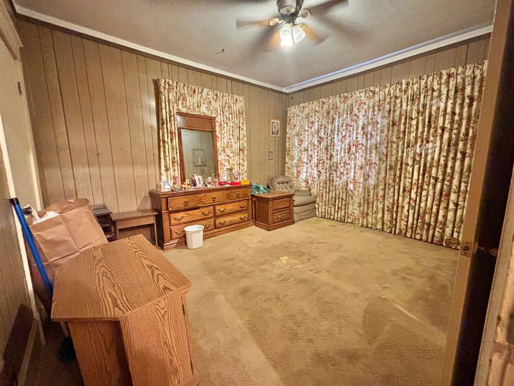619 Delaware Street Dallas, TX 75208 - Photo 5 of 13 a bedroom with furniture and large window