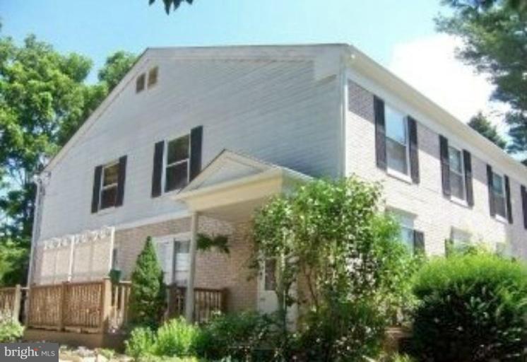 84 Ridgelawn Road, Unit B Reisterstown, MD 21136 - Photo 1 of 17 a aerial view of a house with a yard and plants