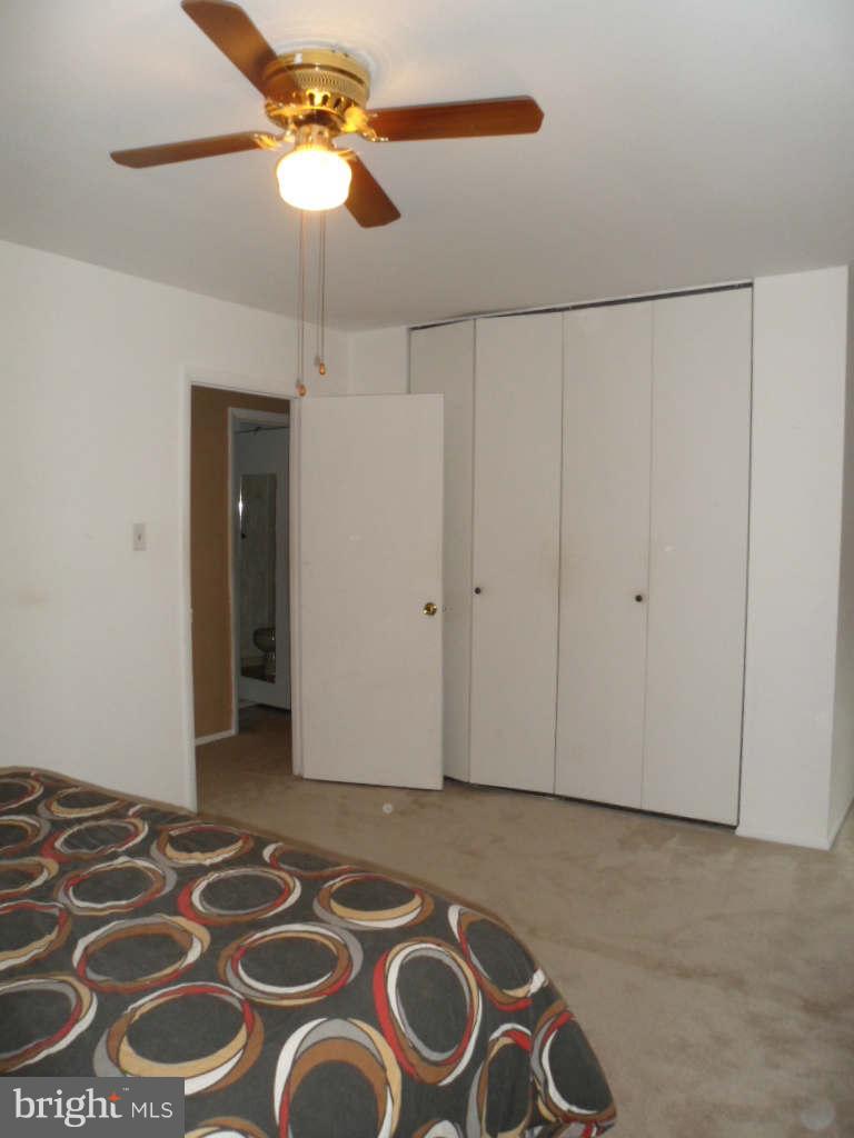 84 Ridgelawn Road, Unit B Reisterstown, MD 21136 - Photo 11 of 17 a view of a livingroom with a chandelier fan