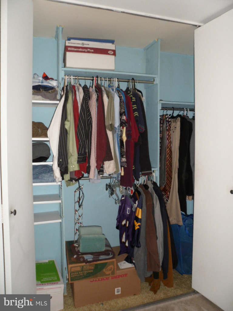 84 Ridgelawn Road, Unit B Reisterstown, MD 21136 - Photo 12 of 17 a view of walk in closet with clothes