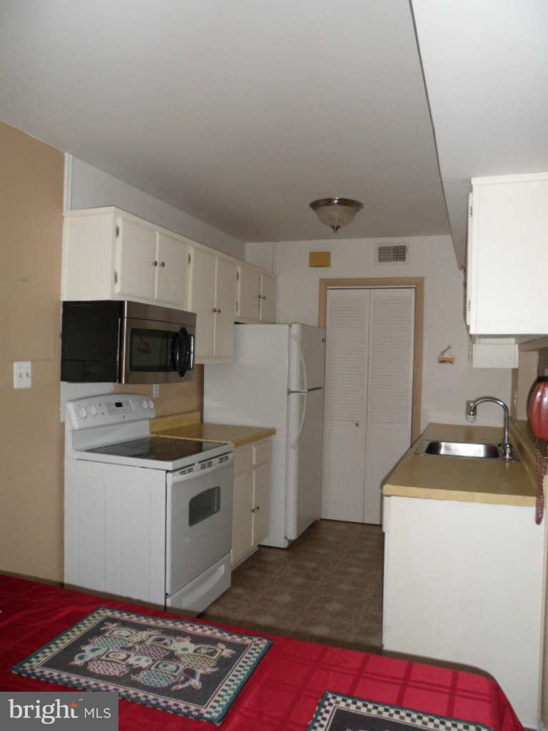 84 Ridgelawn Road, Unit B Reisterstown, MD 21136 - Photo 7 of 17 a room with storage and utility