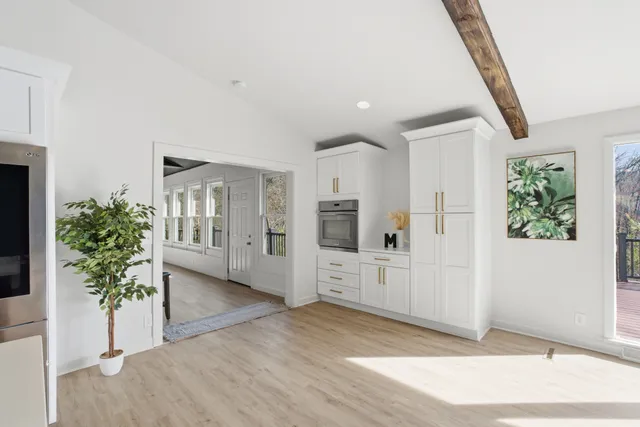 a spacious bedroom with a bed and a couch