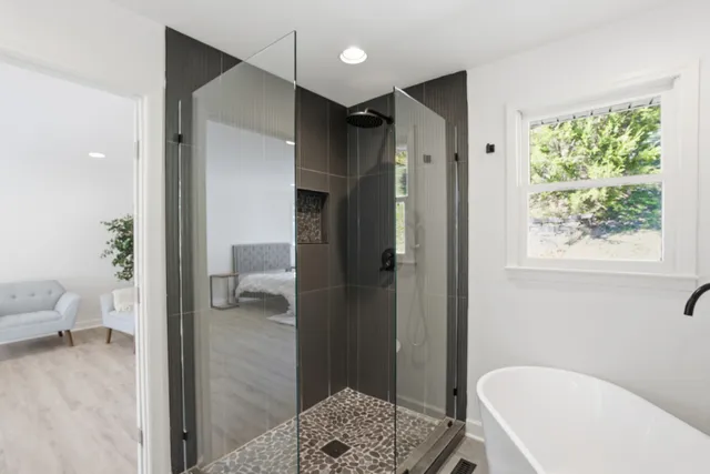 an empty room with wooden floor and a window